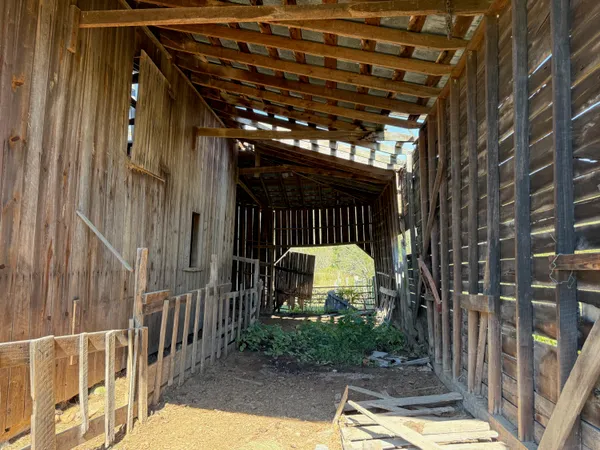 a view of a porch with a door and a glass door