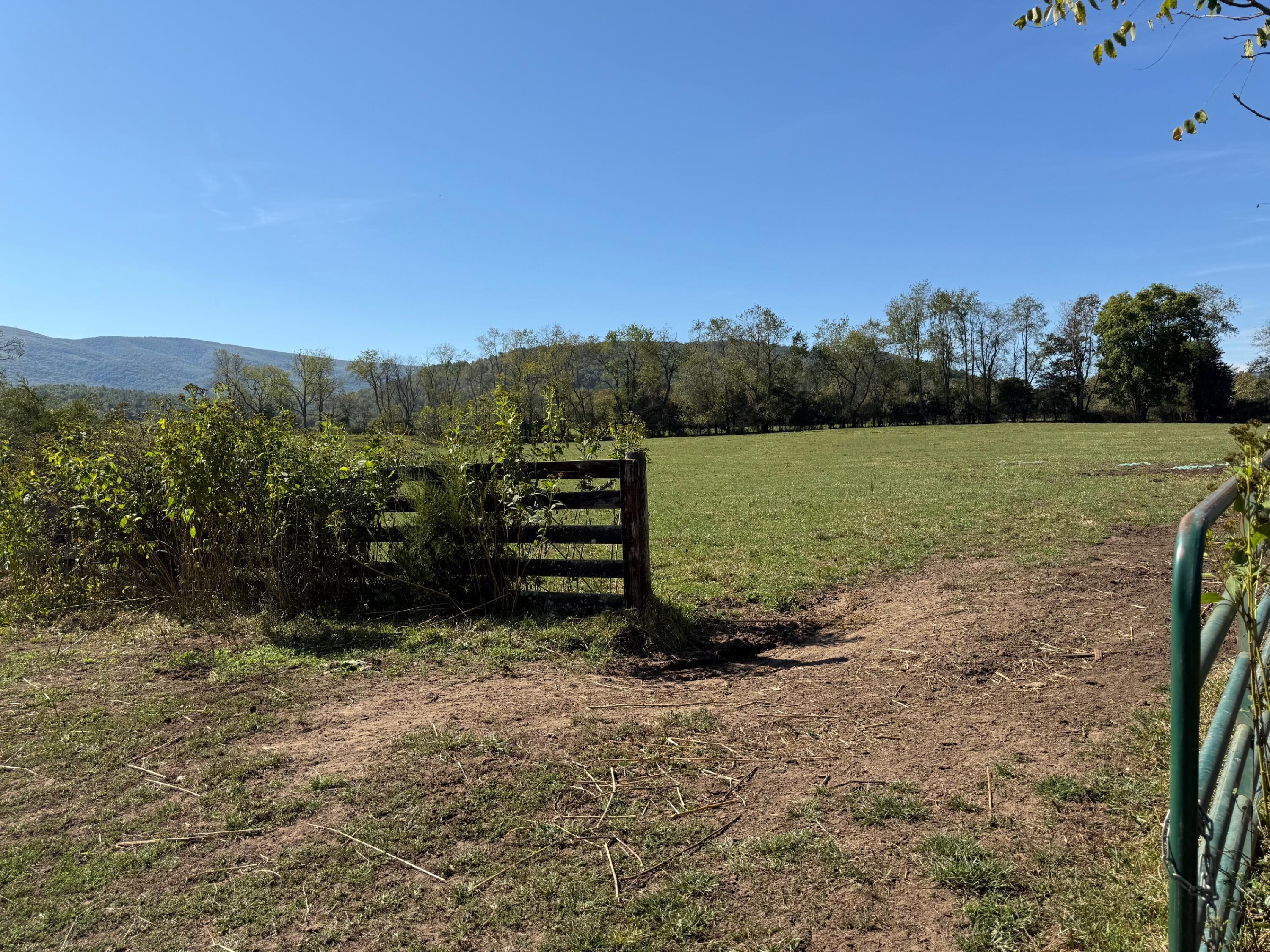 6402 Potts Creek Road Covington, VA 24426 - Photo 18 of 34 a view of a lake with mountain in the back