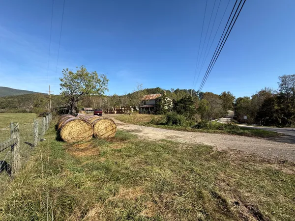 a view of swimming pool outdoor seating and mountain view