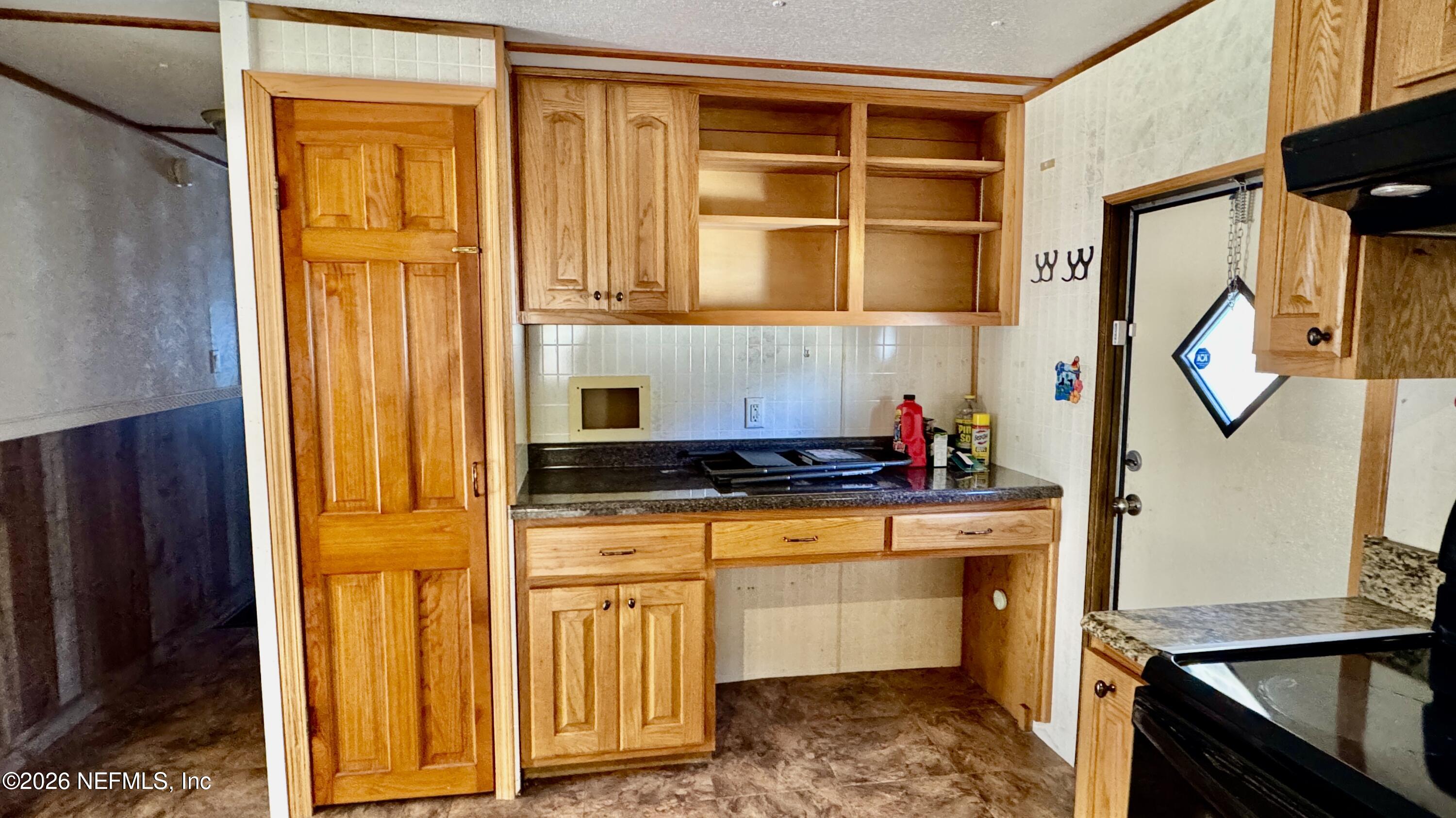 105 Rachel Road Interlachen, FL 32148 - Photo 16 of 24 a kitchen with stainless steel appliances a stove and a refrigerator