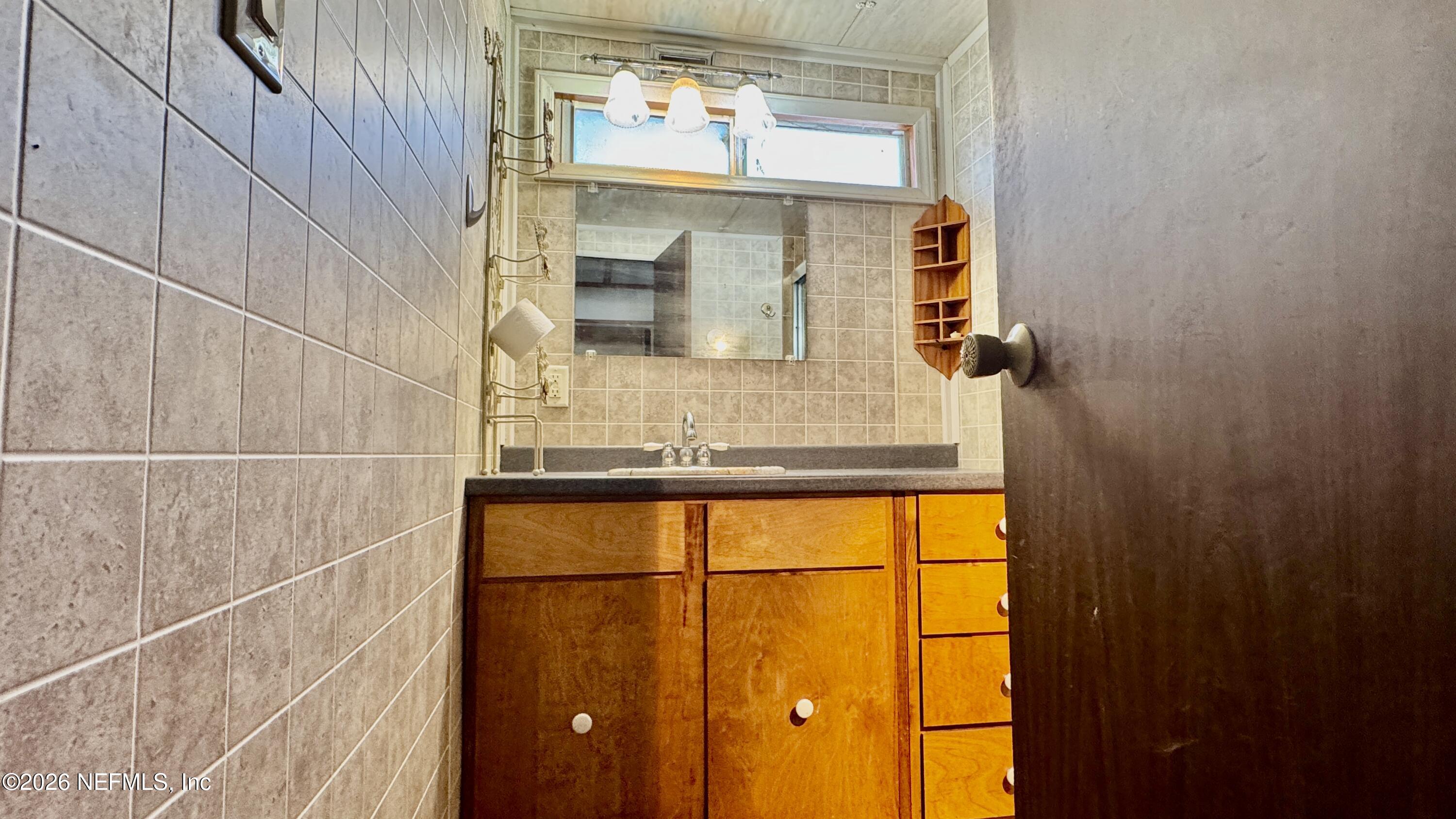 105 Rachel Road Interlachen, FL 32148 - Photo 18 of 24 a bathroom with a sink and a mirror