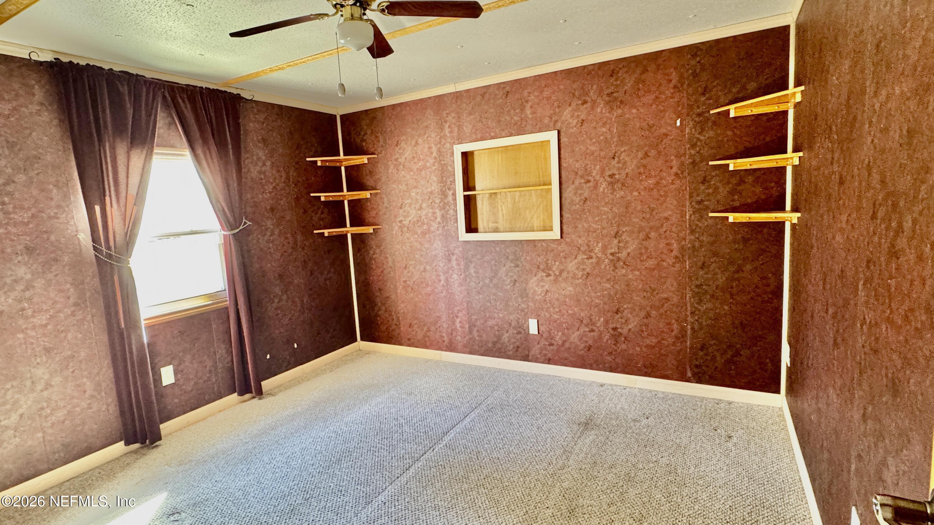 105 Rachel Road Interlachen, FL 32148 - Photo 21 of 24 a view of a livingroom with a ceiling fan