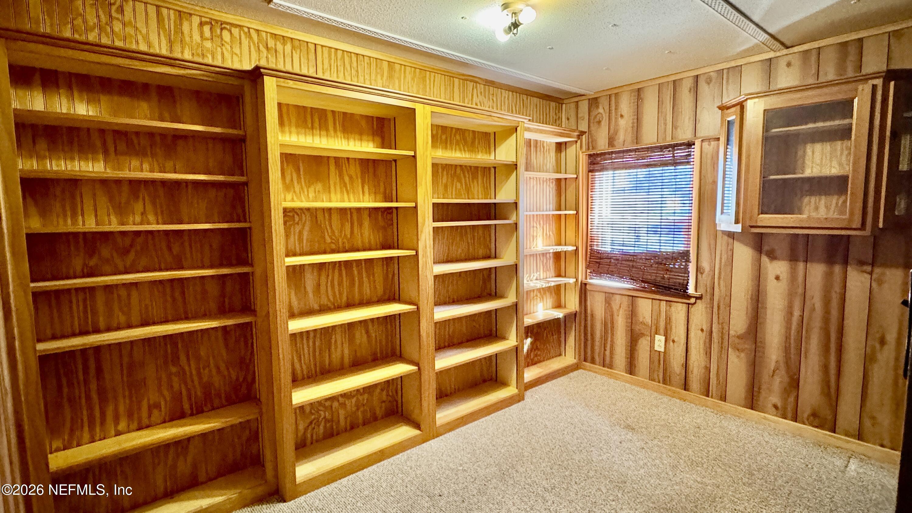 105 Rachel Road Interlachen, FL 32148 - Photo 22 of 24 a view of an empty room with empty shelves