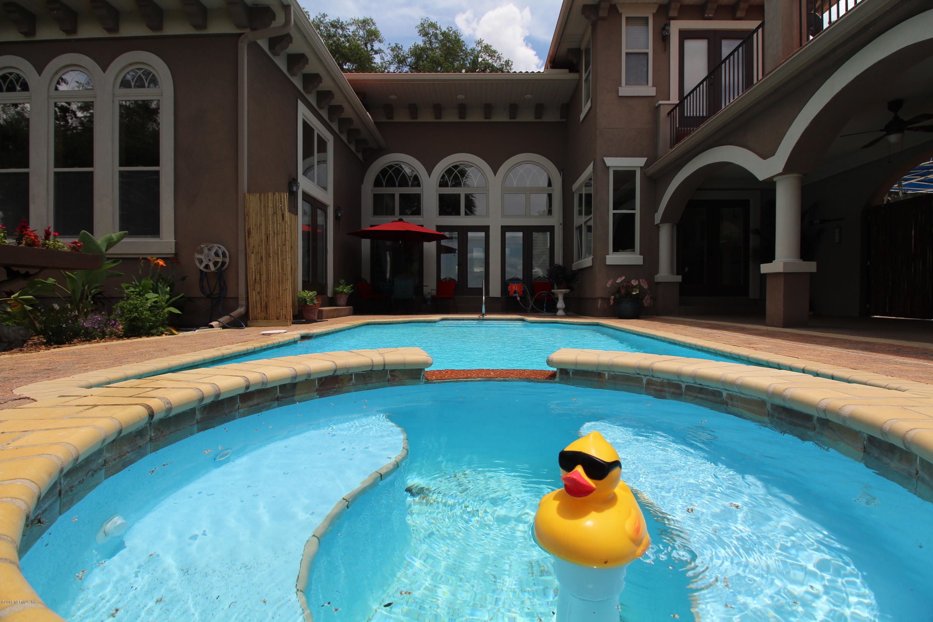 6471 Immokalee Road Keystone Heights, FL 32656 - Photo 18 of 103 a front view of a house with swimming pool