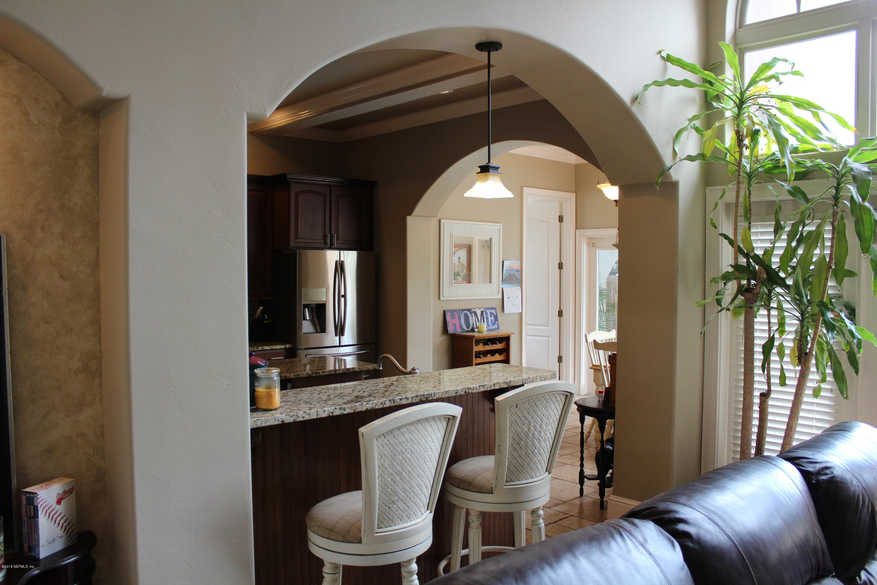 6471 Immokalee Road Keystone Heights, FL 32656 - Photo 19 of 103 a living room with furniture and a potted plant