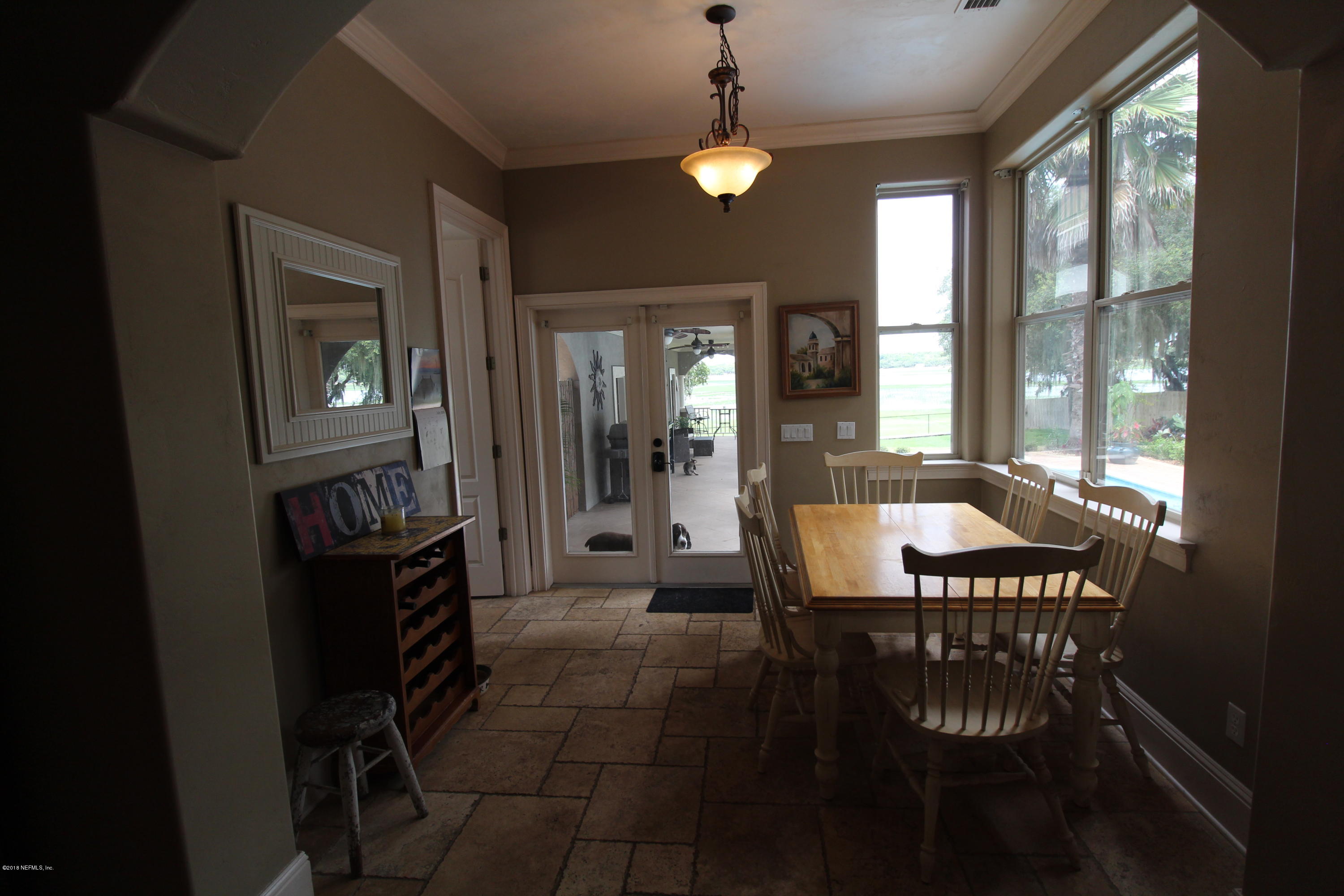6471 Immokalee Road Keystone Heights, FL 32656 - Photo 22 of 103 a view of a dining room with furniture window and outside view