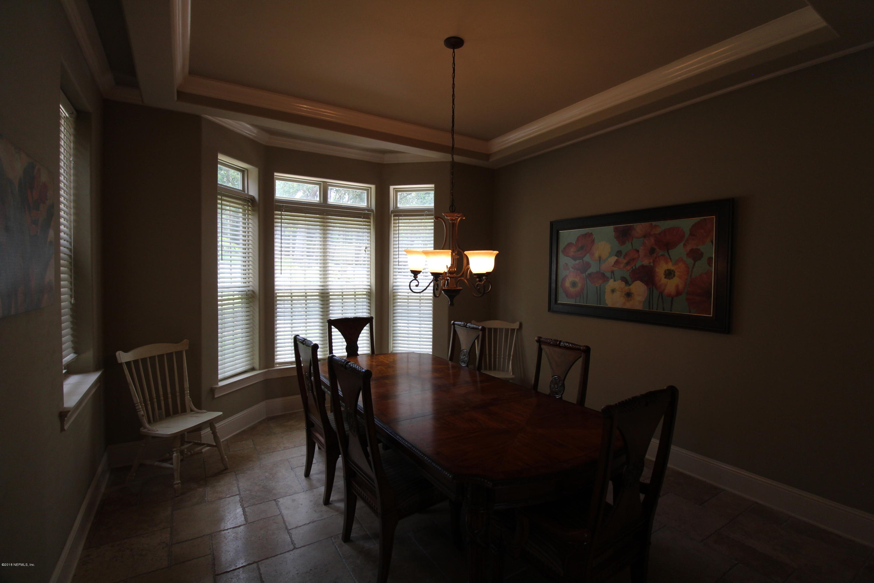 6471 Immokalee Road Keystone Heights, FL 32656 - Photo 32 of 103 a view of a dining room with furniture window and outside view