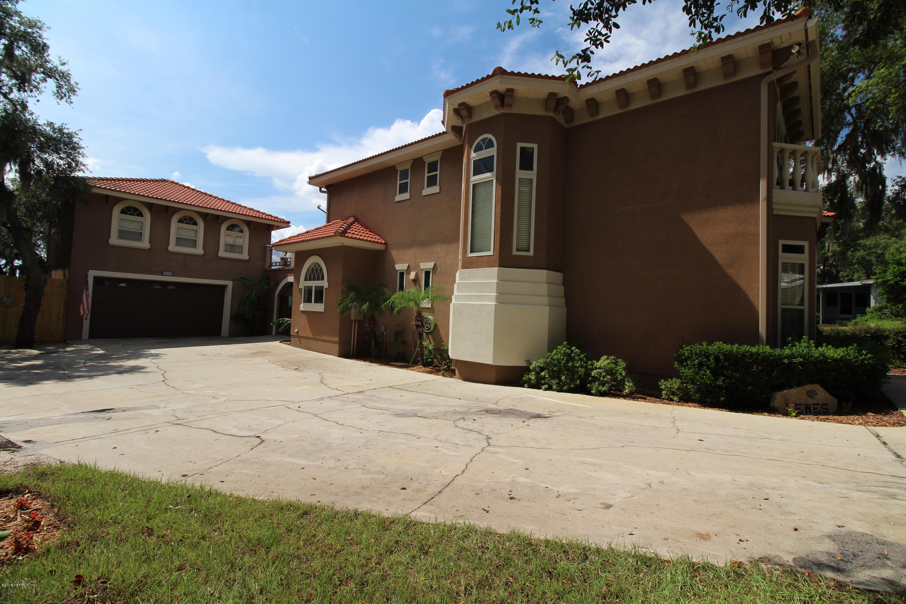 6471 Immokalee Road Keystone Heights, FL 32656 - Photo 42 of 103 a front view of a house with a yard and garage