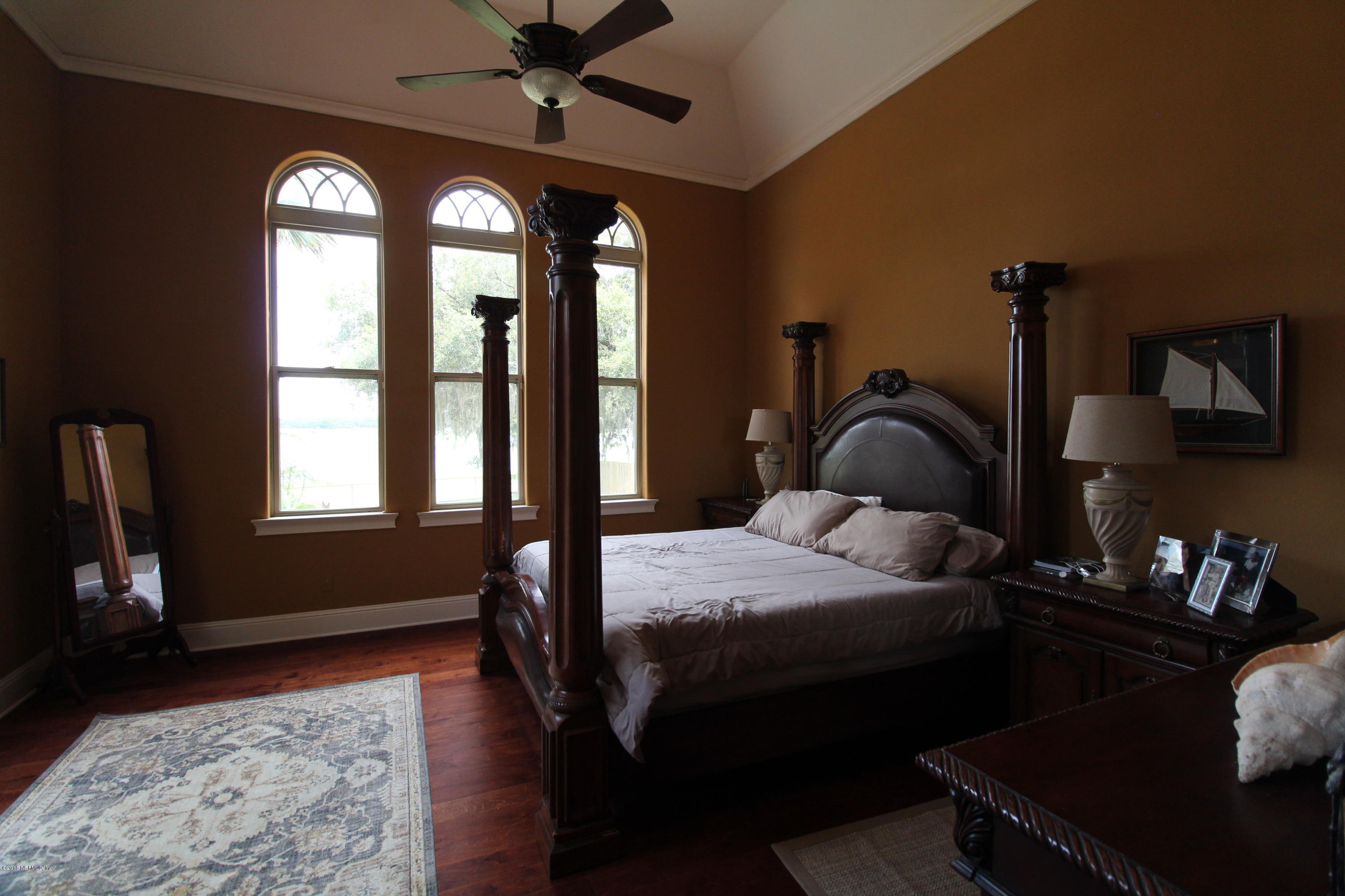 6471 Immokalee Road Keystone Heights, FL 32656 - Photo 46 of 103 a bedroom with a bed and a window