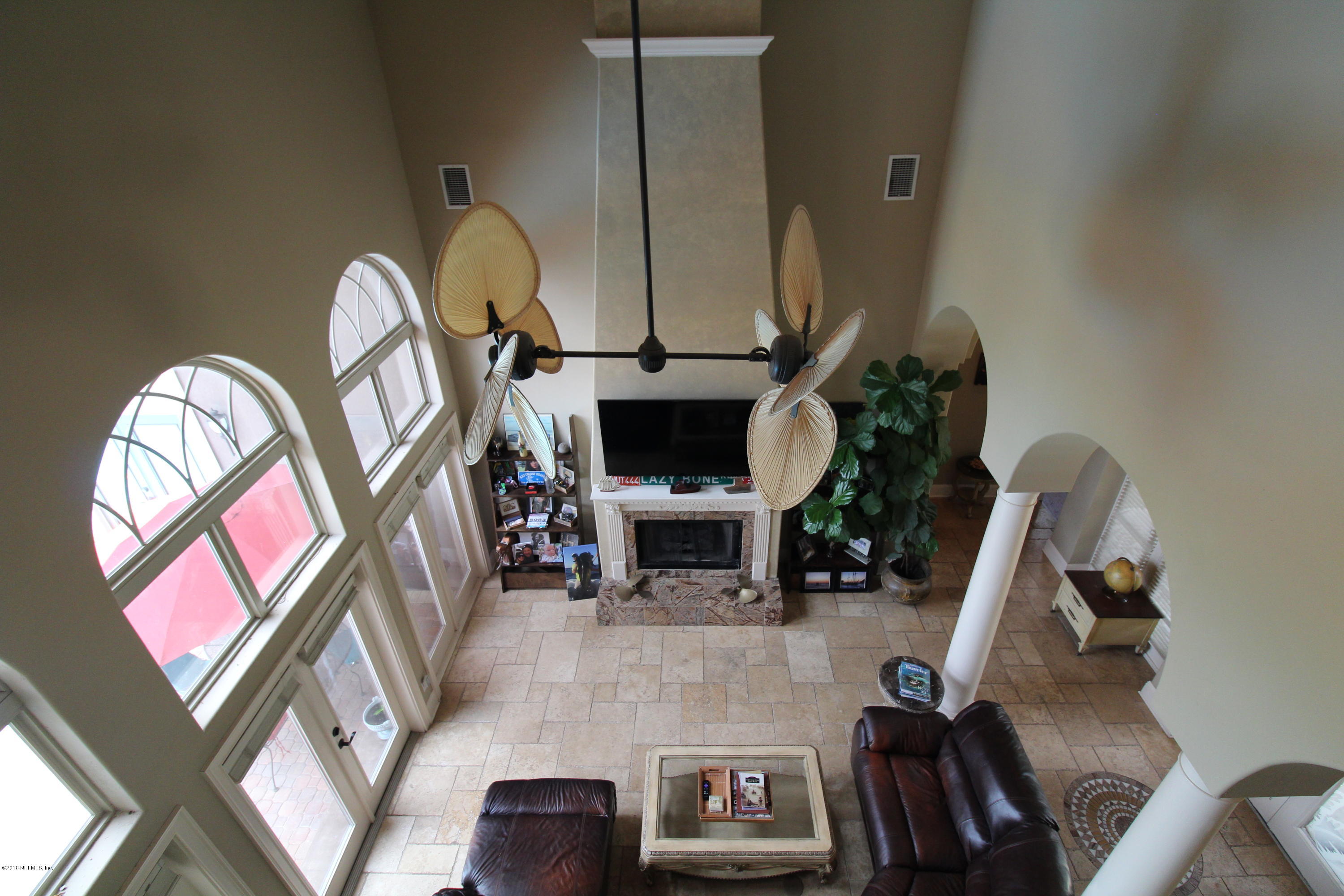 6471 Immokalee Road Keystone Heights, FL 32656 - Photo 54 of 103 a living room with furniture a fireplace and a flat screen tv