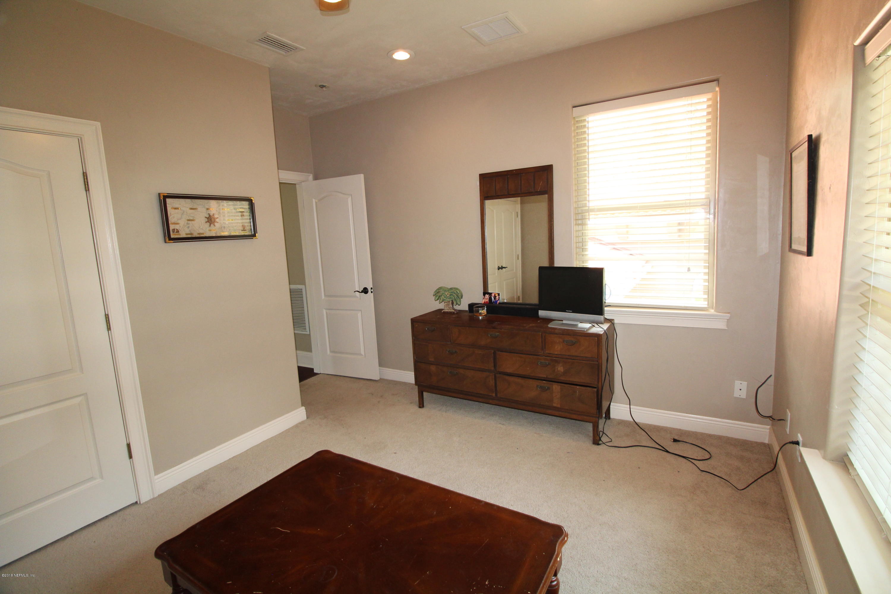6471 Immokalee Road Keystone Heights, FL 32656 - Photo 55 of 103 a room with a window and a rug