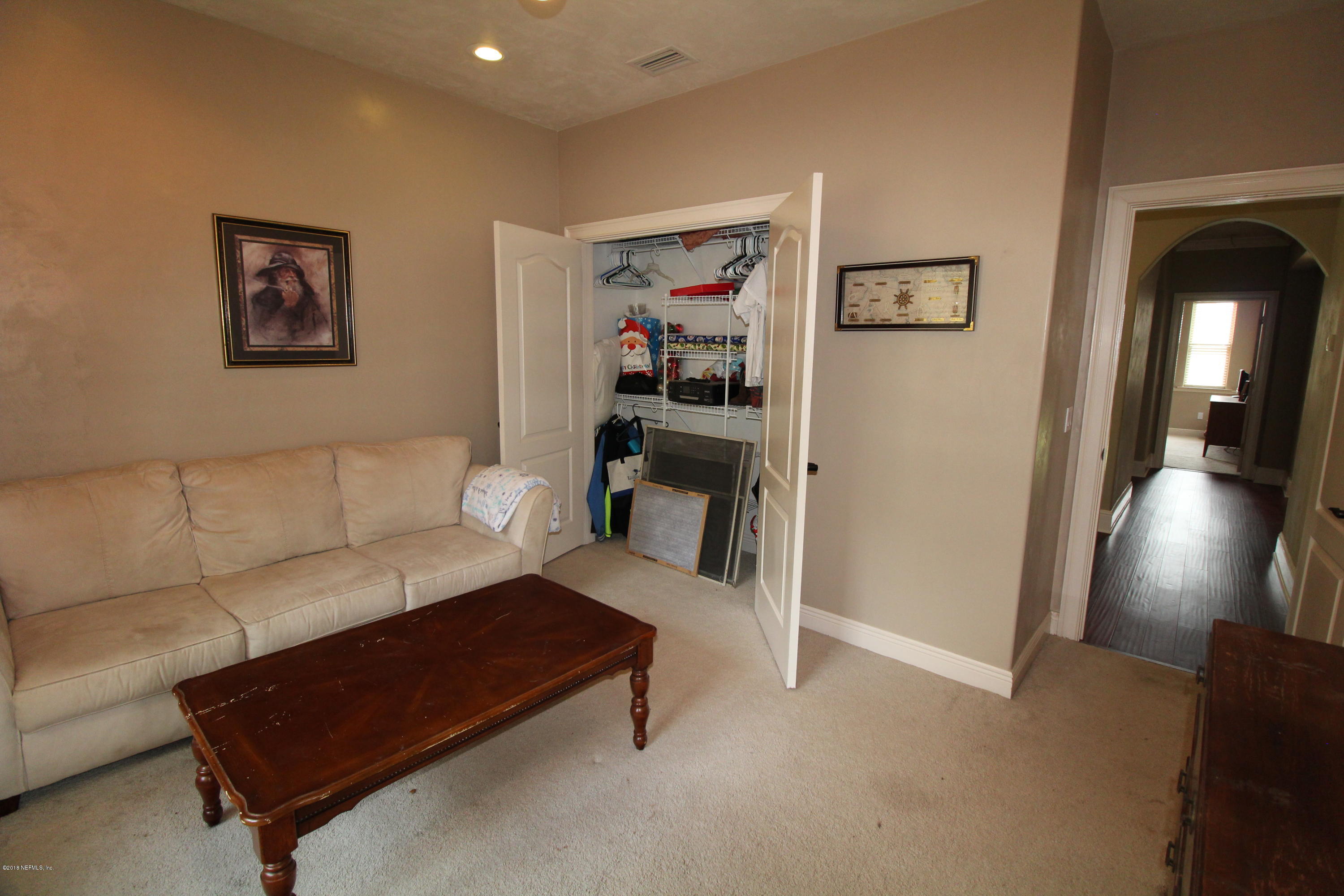 6471 Immokalee Road Keystone Heights, FL 32656 - Photo 56 of 103 a living room with furniture and a view of bathroom
