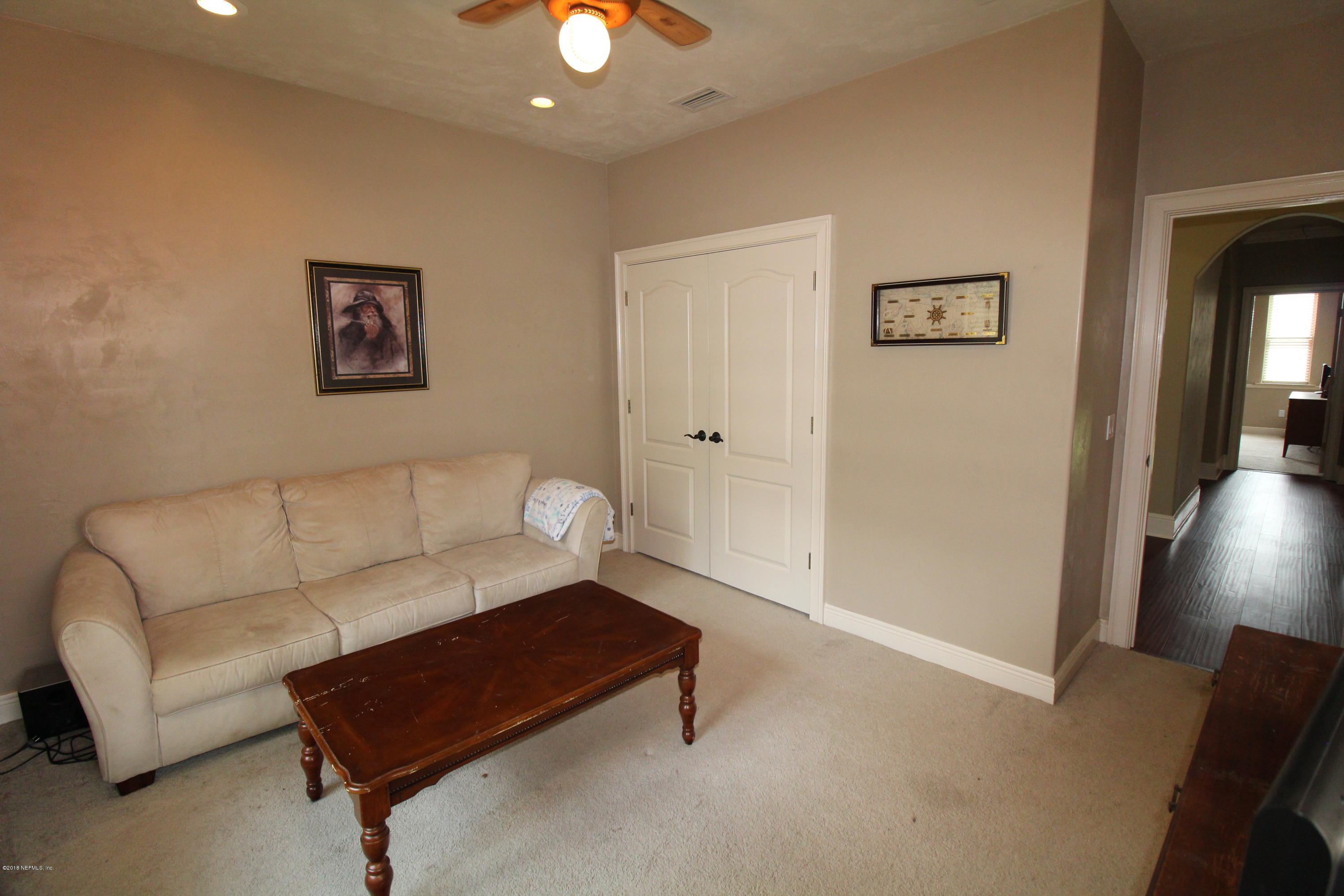 6471 Immokalee Road Keystone Heights, FL 32656 - Photo 57 of 103 a living room with furniture and a potted plant