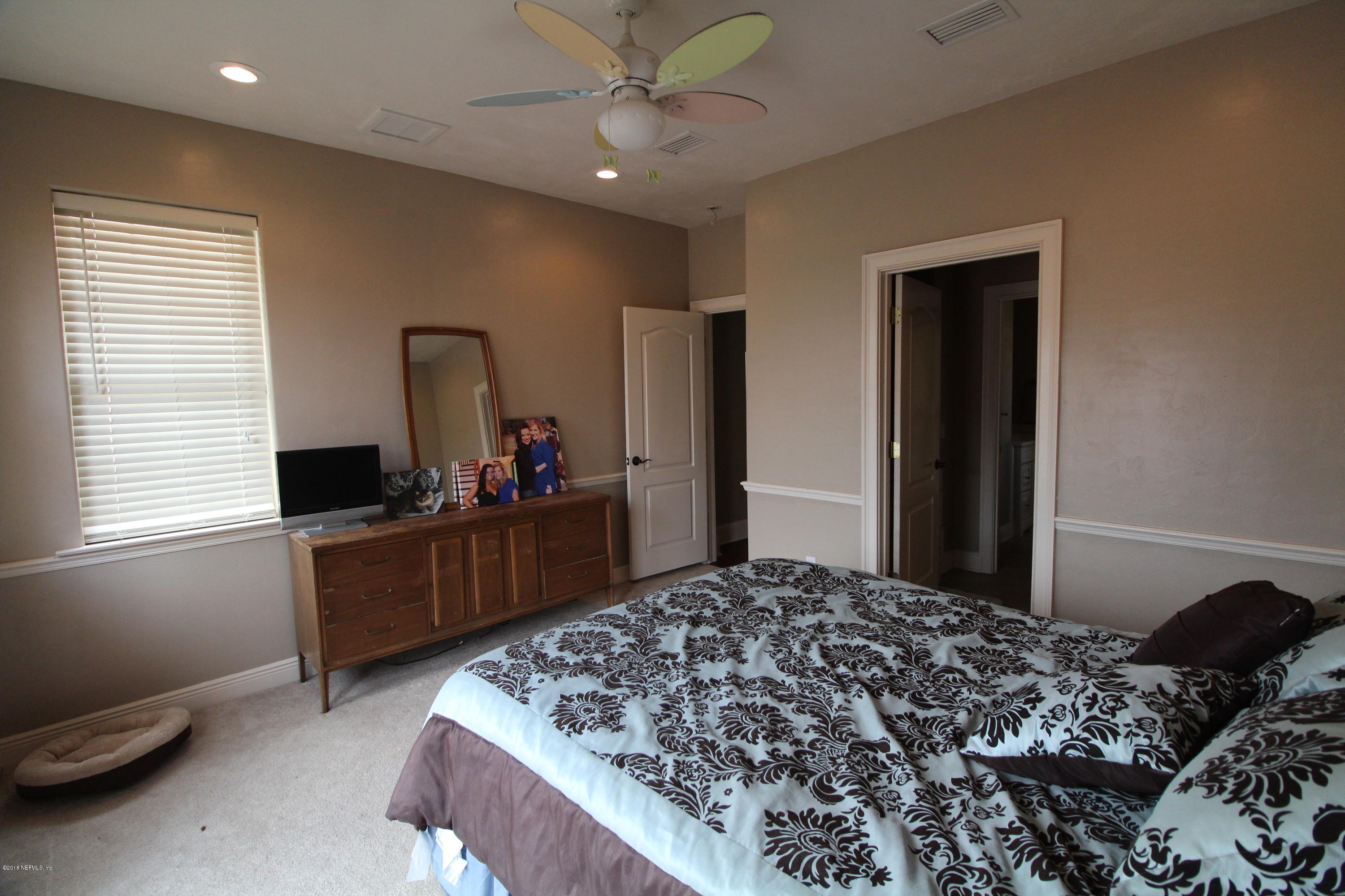 6471 Immokalee Road Keystone Heights, FL 32656 - Photo 59 of 103 a bed room with a bed and a television