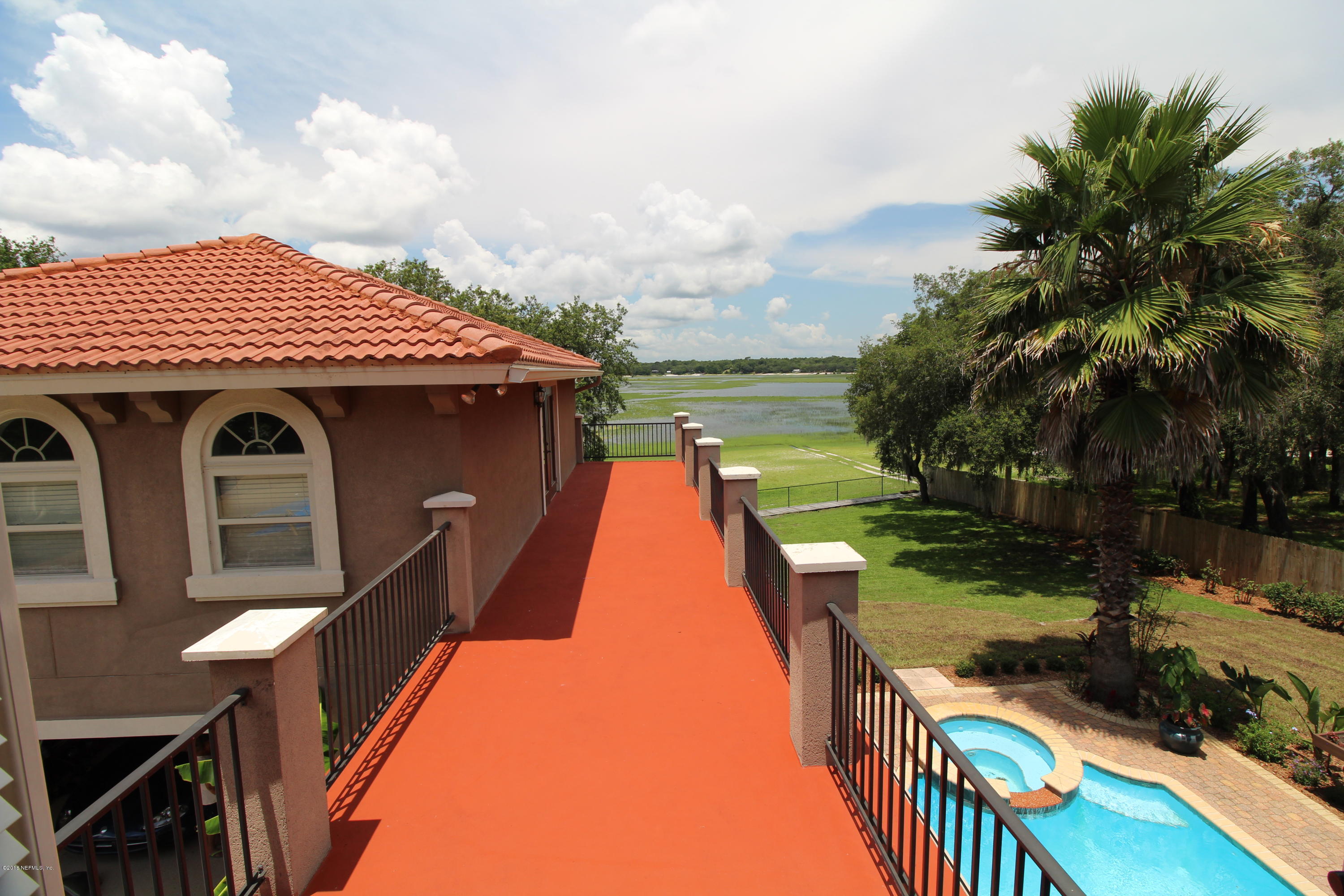 6471 Immokalee Road Keystone Heights, FL 32656 - Photo 70 of 103 a view of a house with swimming pool and sitting area