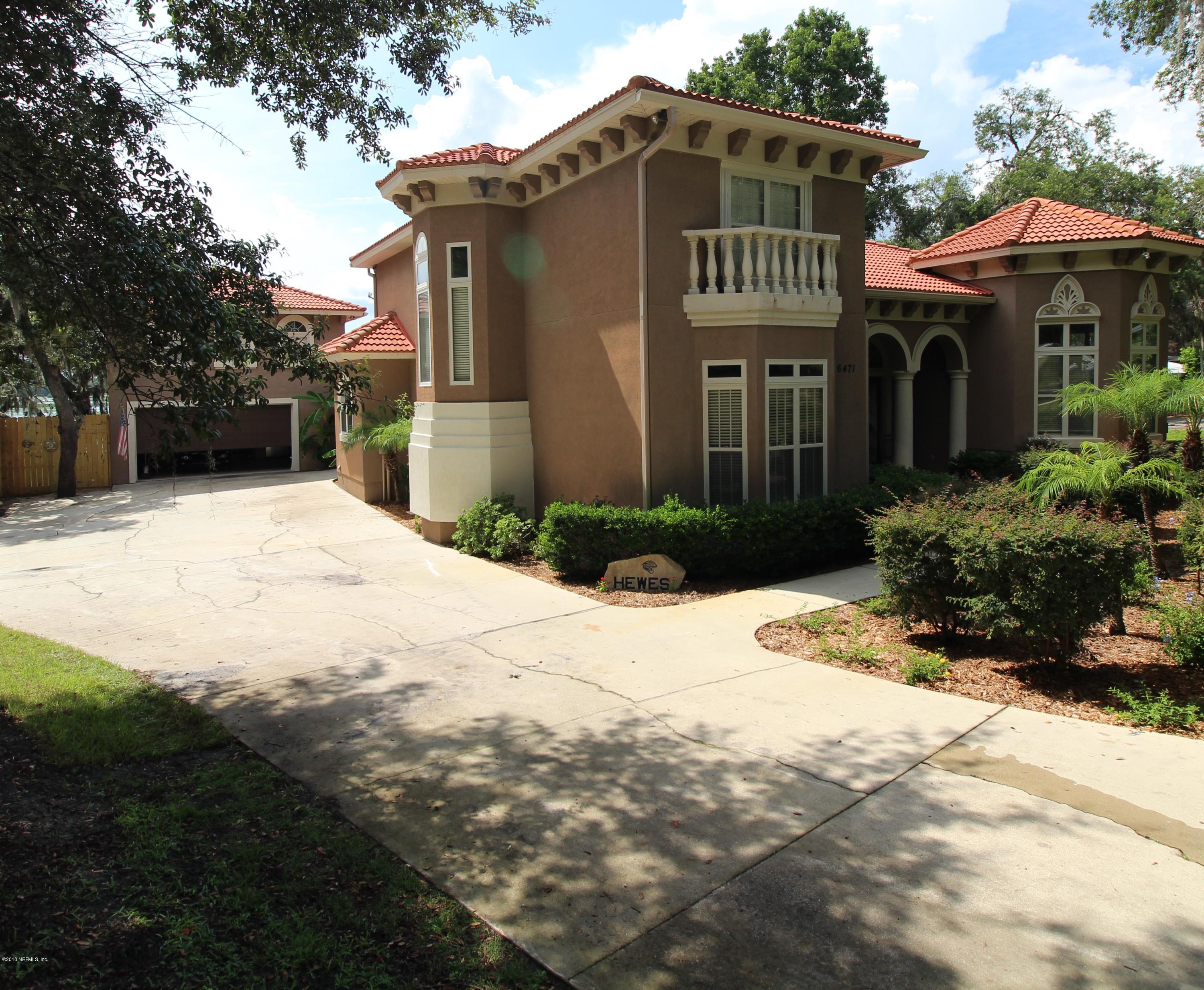 6471 Immokalee Road Keystone Heights, FL 32656 - Photo 85 of 103 a front view of a house with garden
