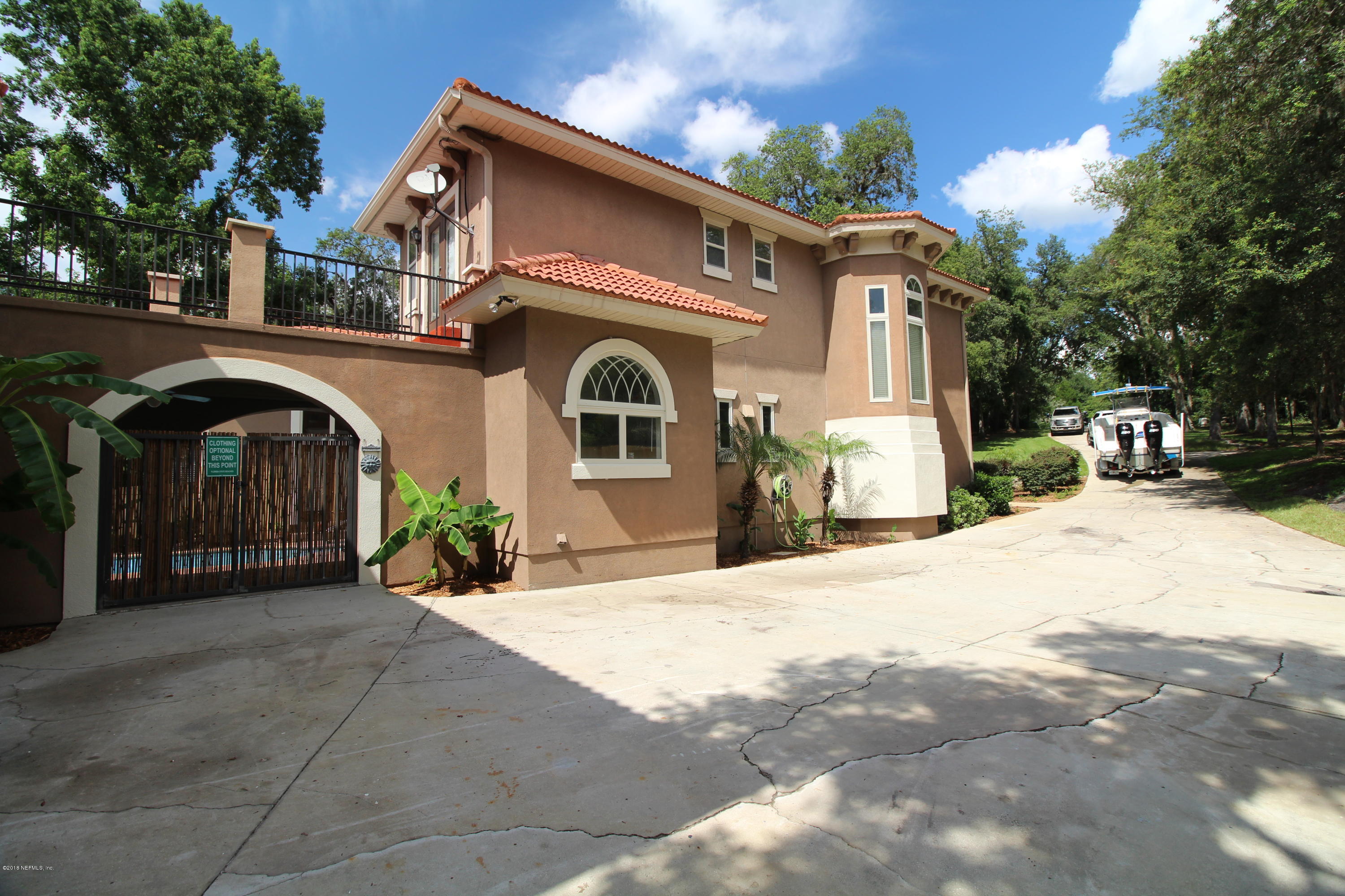 6471 Immokalee Road Keystone Heights, FL 32656 - Photo 88 of 103 a front view of a house with yard