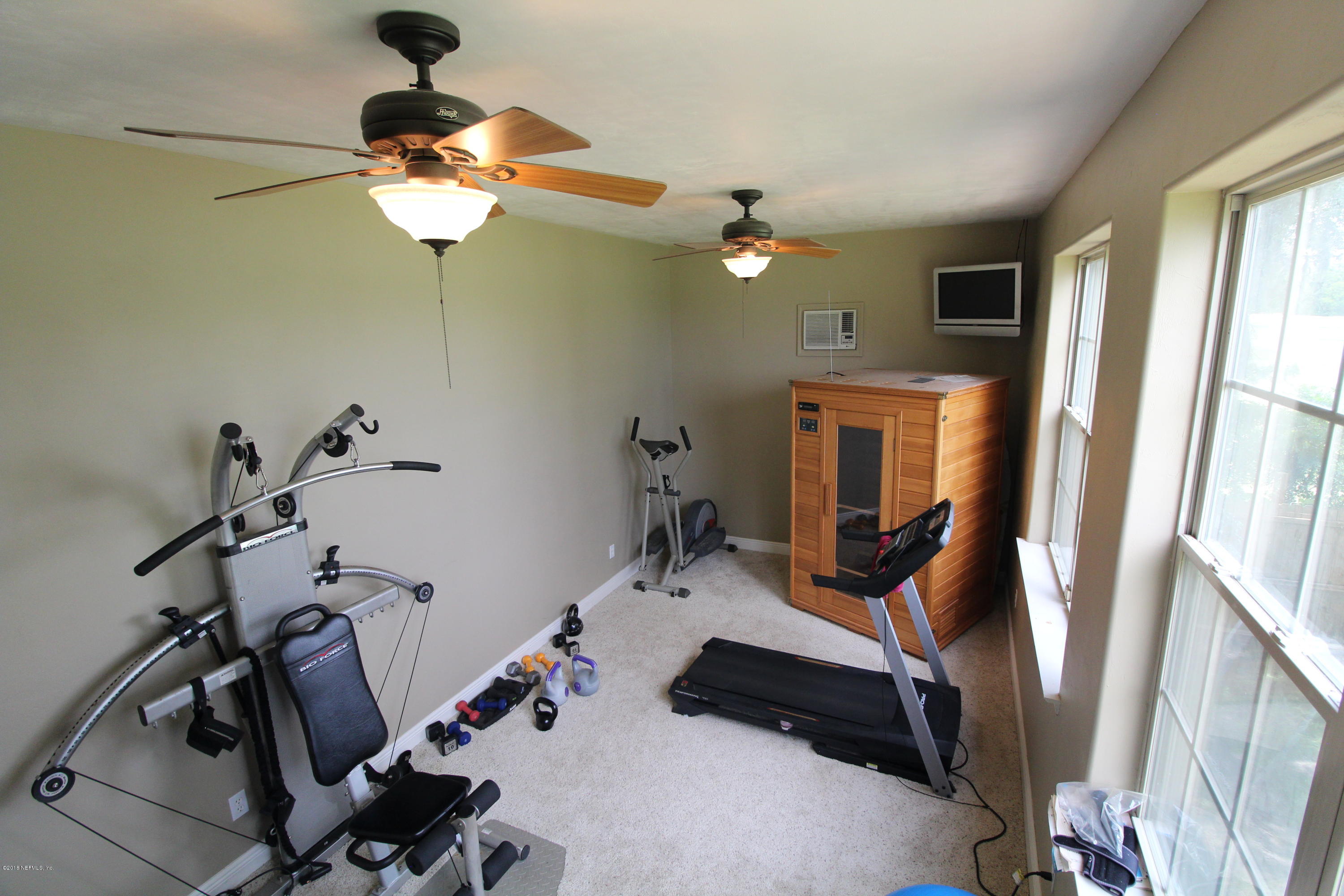 6471 Immokalee Road Keystone Heights, FL 32656 - Photo 92 of 103 a view of a room with gym equipment