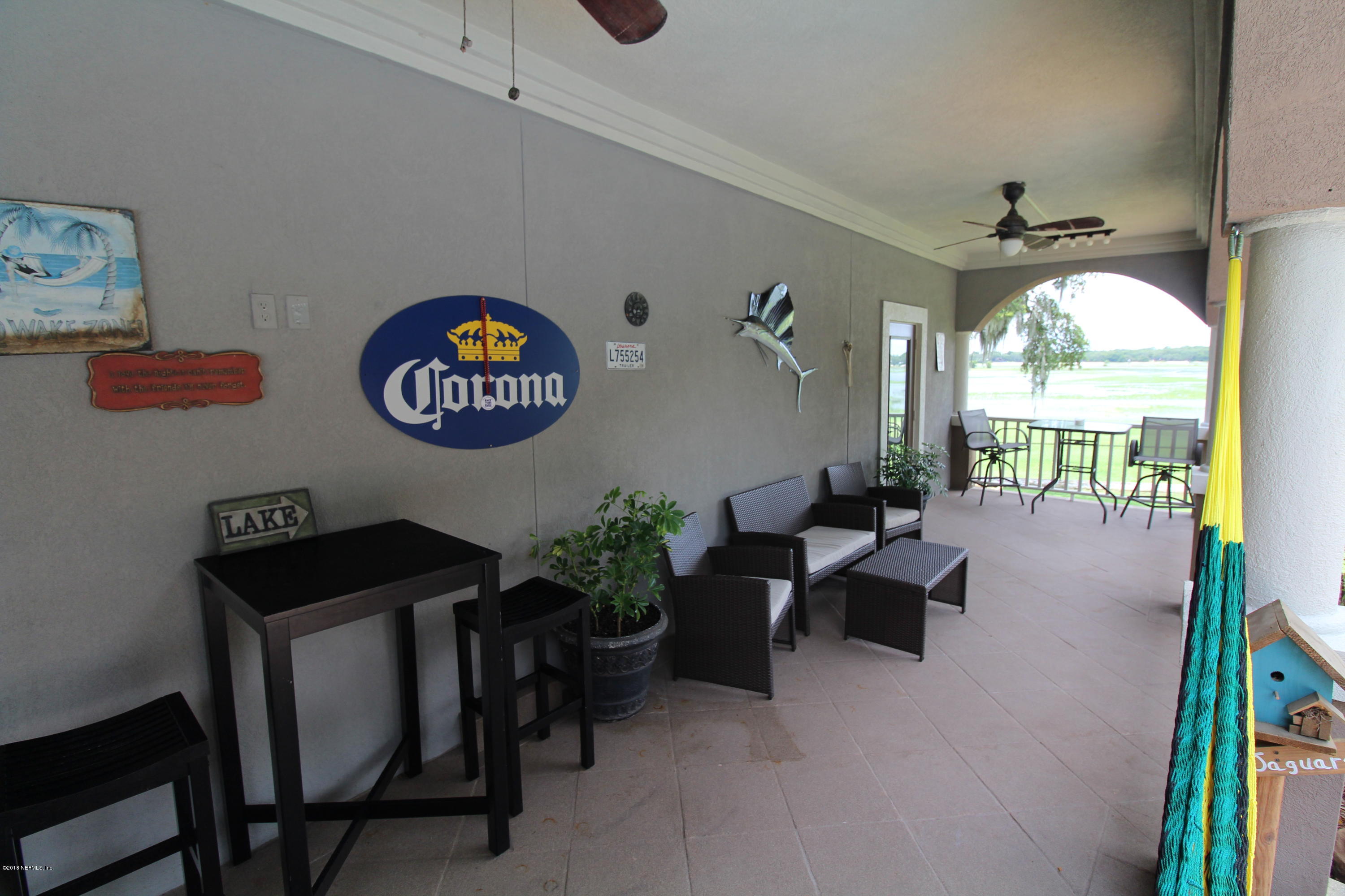 6471 Immokalee Road Keystone Heights, FL 32656 - Photo 95 of 103 a living room with furniture and a large window