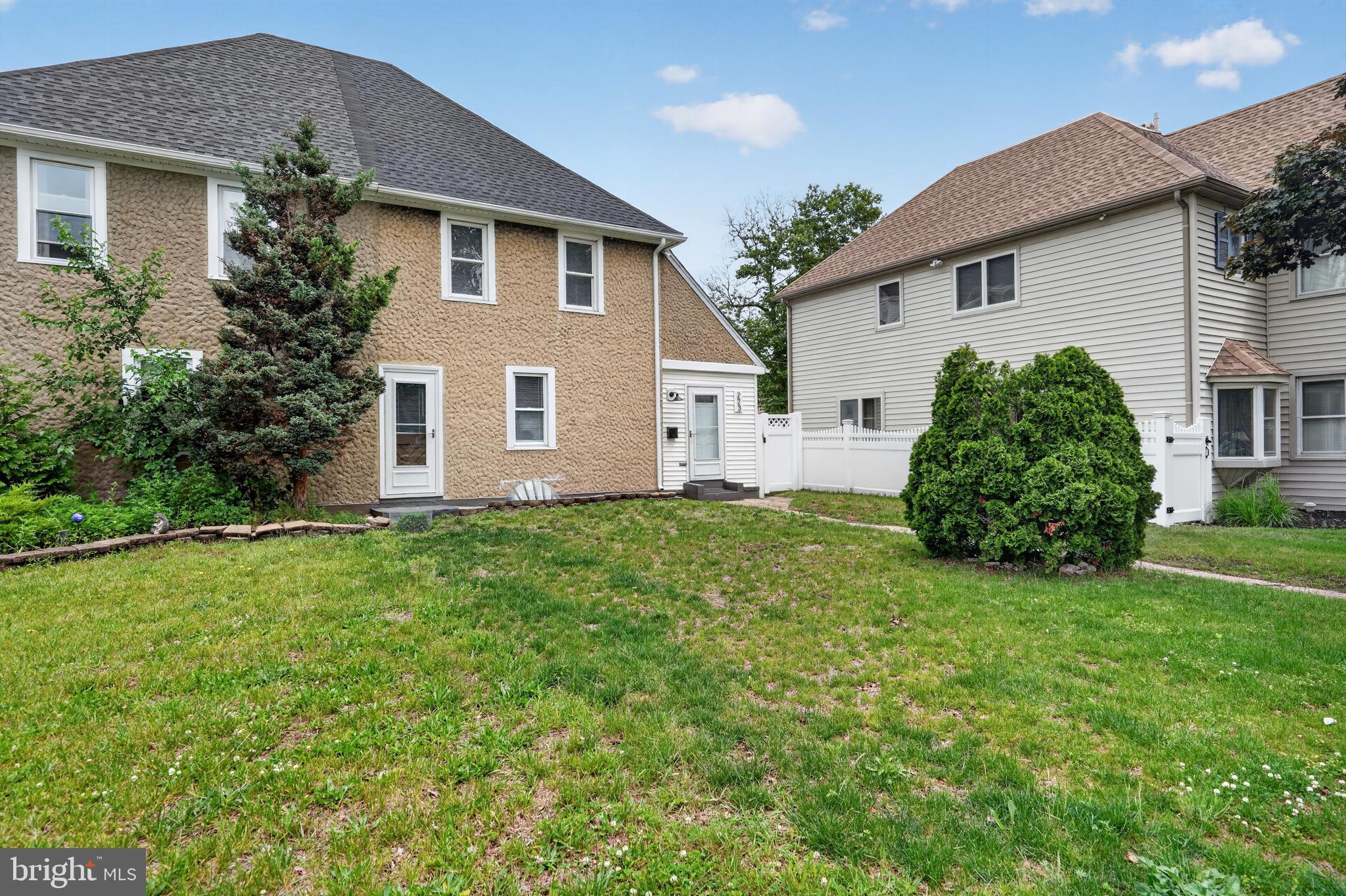 223 Noreg Place Brooklawn, NJ 08030 - Photo 2 of 36 a front view of a house with a garden