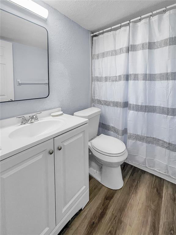 4913 East Temple Heights Road, Unit A Tampa, FL 33617 - Photo 22 of 41 a bathroom with a toilet a sink and shower