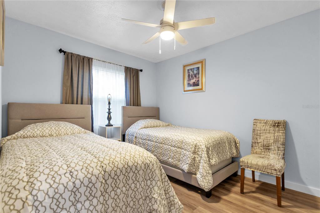 4913 East Temple Heights Road, Unit A Tampa, FL 33617 - Photo 23 of 41 a bedroom with double bed and a window