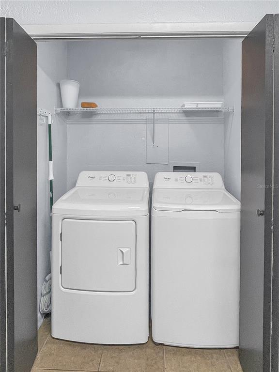 4913 East Temple Heights Road, Unit A Tampa, FL 33617 - Photo 24 of 41 a utility room with dryer and washer
