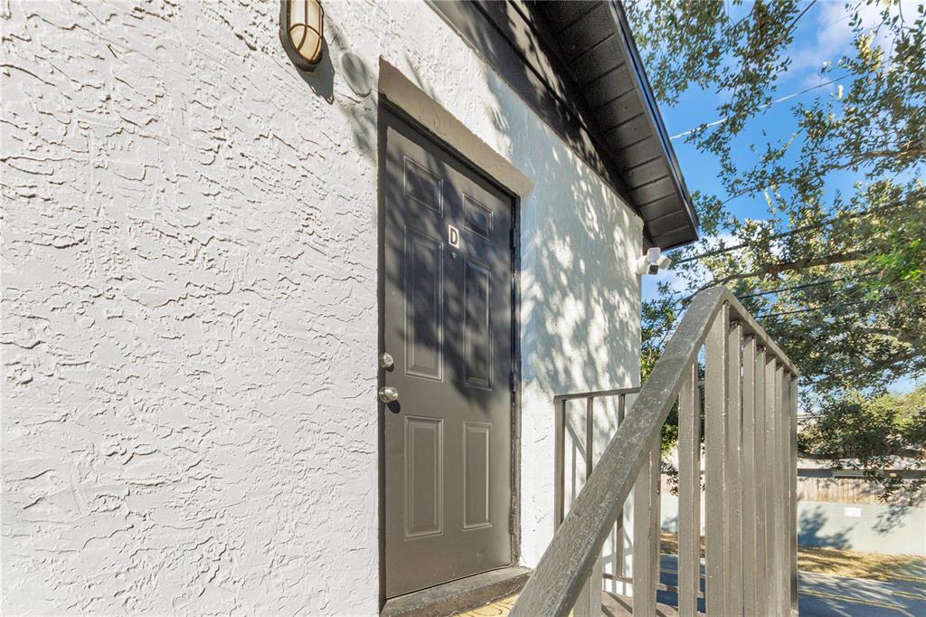 4913 East Temple Heights Road, Unit A Tampa, FL 33617 - Photo 25 of 41 a view of balcony with wooden floor and wall