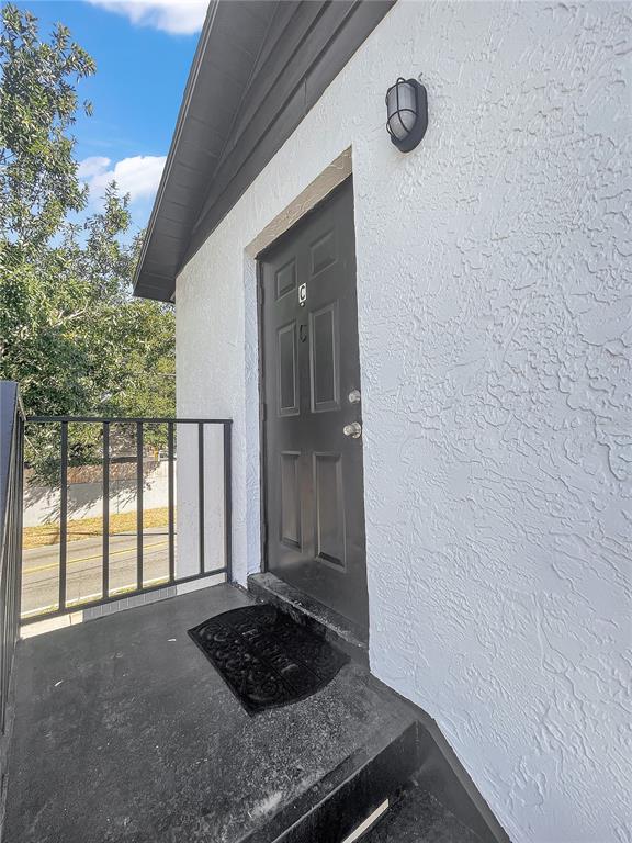 4913 East Temple Heights Road, Unit A Tampa, FL 33617 - Photo 3 of 41 a view of a door and a rug