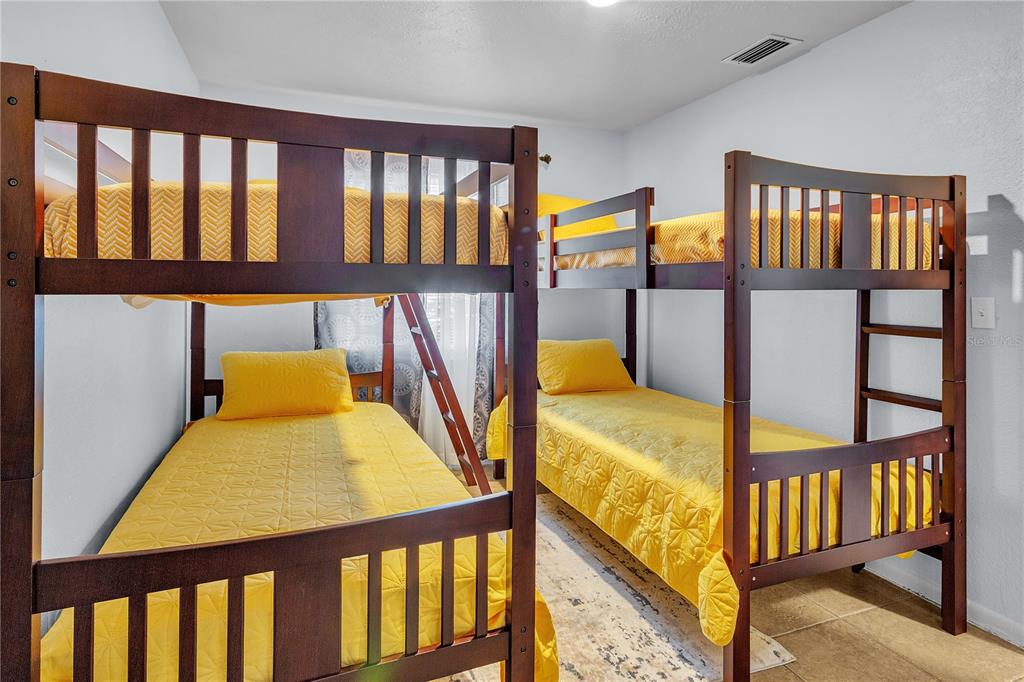 4913 East Temple Heights Road, Unit A Tampa, FL 33617 - Photo 33 of 41 a view of a bedroom with furniture