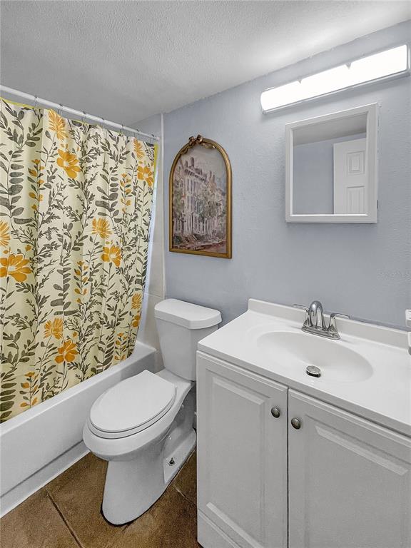 4913 East Temple Heights Road, Unit A Tampa, FL 33617 - Photo 39 of 41 a white toilet sitting next to a bathroom sink