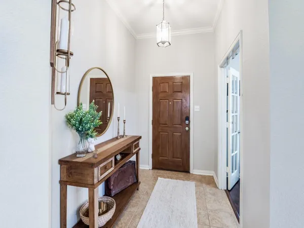 a view of an entryway with wooden floor