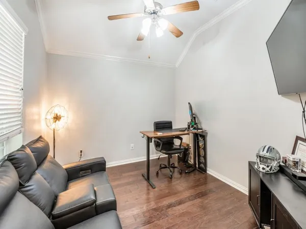 a living room with furniture and a dining table