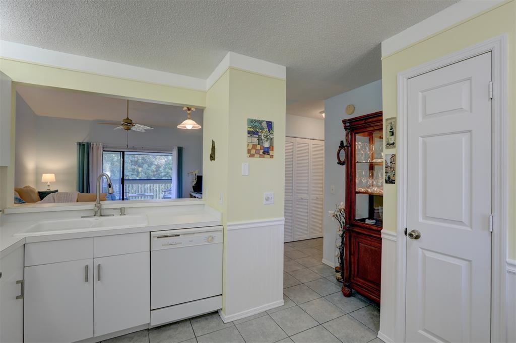 9635 Riverside Drive Sebastian, FL 32958 - Photo 18 of 58 a bathroom with a sink a toilet and a mirror