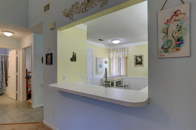 a kitchen with a stove and a refrigerator