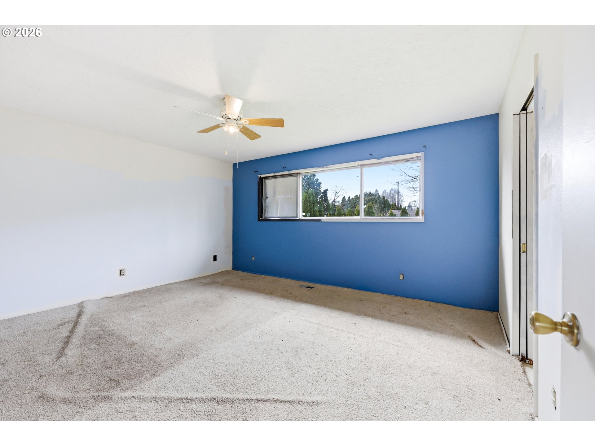 205 Southeast Olvera Avenue Gresham, OR 97080 - Photo 13 of 13 a view of an empty room with a window