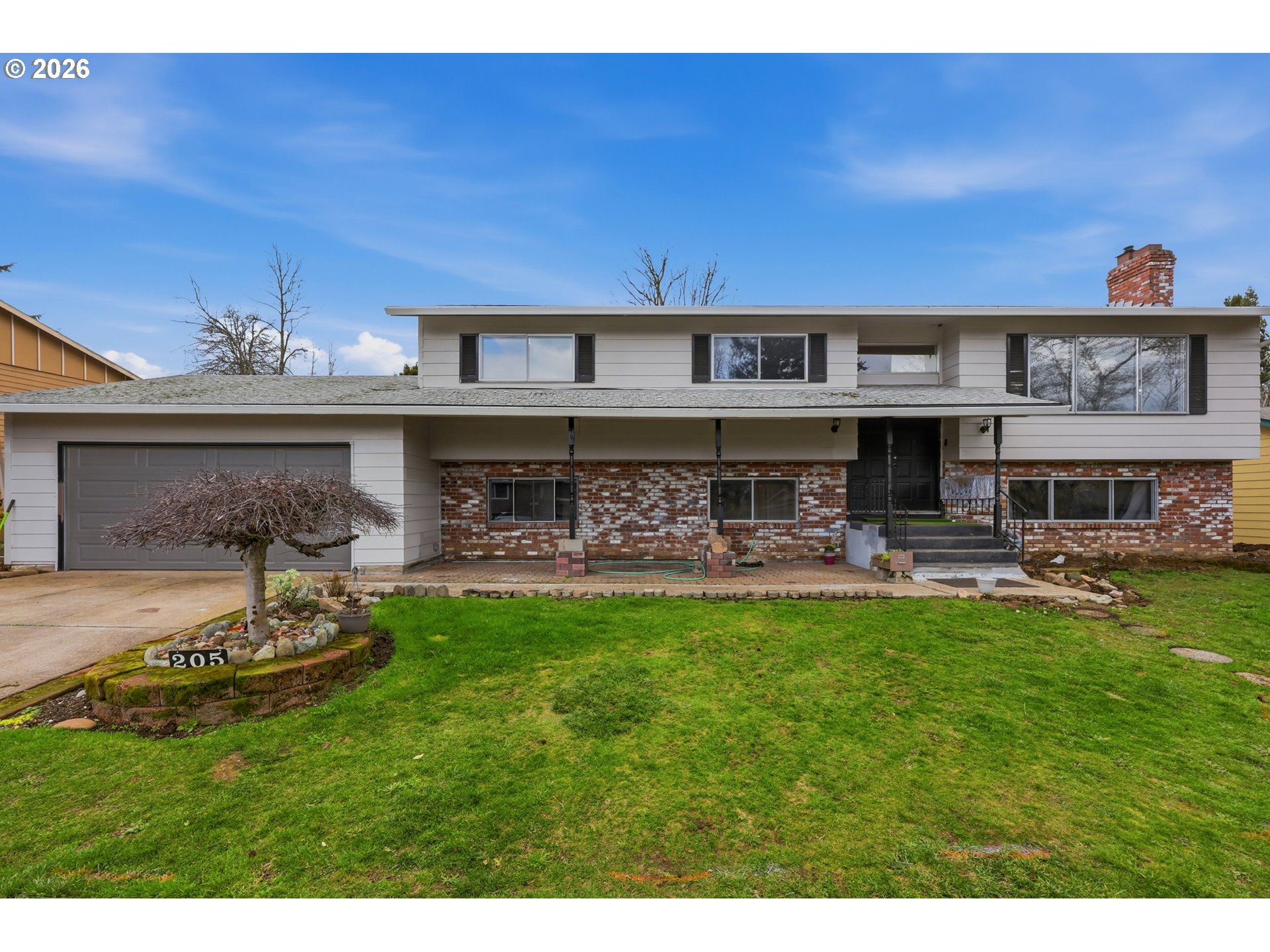 205 Southeast Olvera Avenue Gresham, OR 97080 - Photo 3 of 13 a view of a house with swimming pool and sitting area