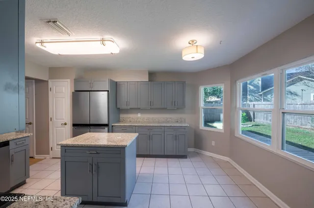 a large kitchen with a large window