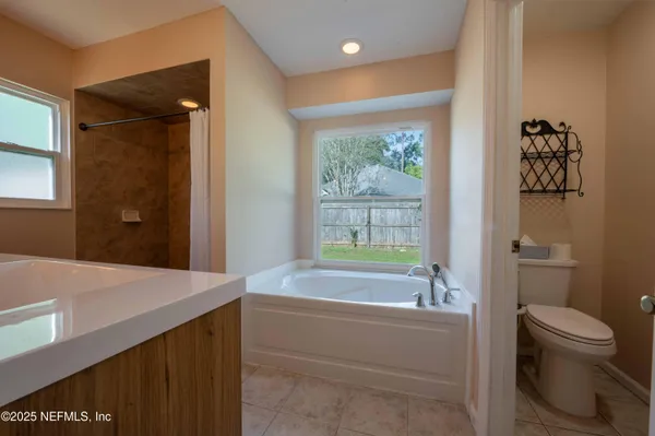 a bathroom with a bathtub sink and toilet