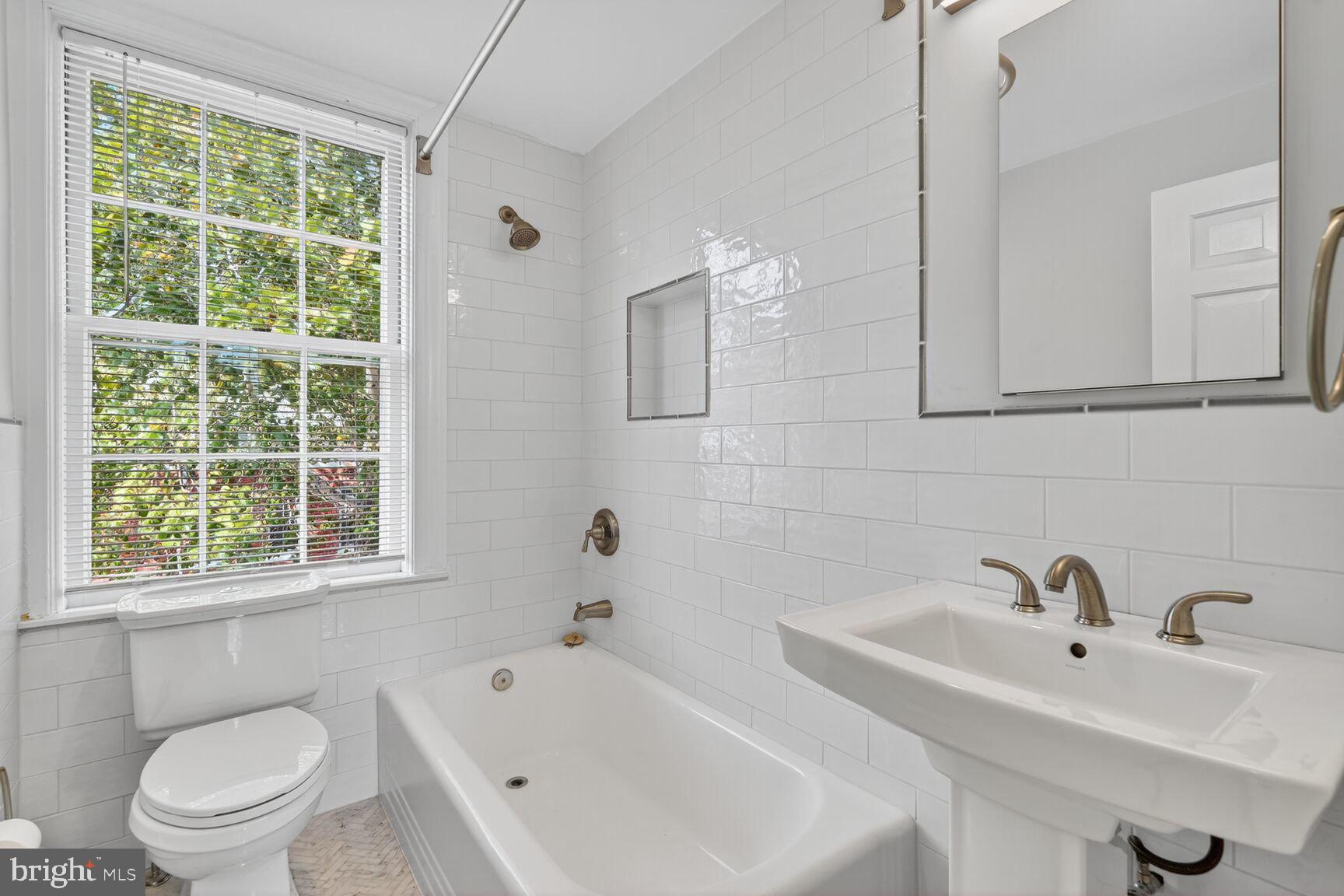 1363 28th Street Northwest, Unit 3 Washington, DC 20007 - Photo 4 of 13 a bathroom with a sink and a bathtub