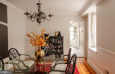 a room with a chandelier and living room view