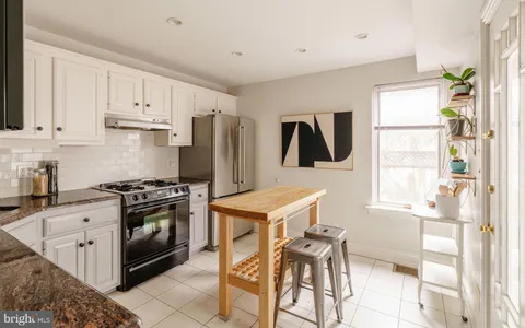 a view of table and window in kitchen
