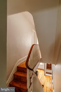 a bathroom with a sink a mirror and a shower