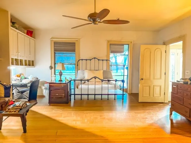 a bathroom with a granite countertop sink a mirror and a shower