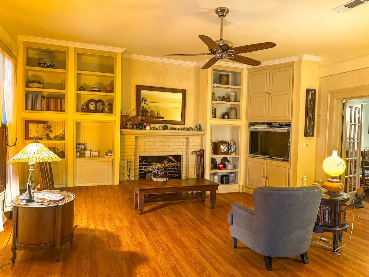 618 West Main Street Fairfield, TX 75840 - Photo 4 of 23 a living room with furniture and a fireplace