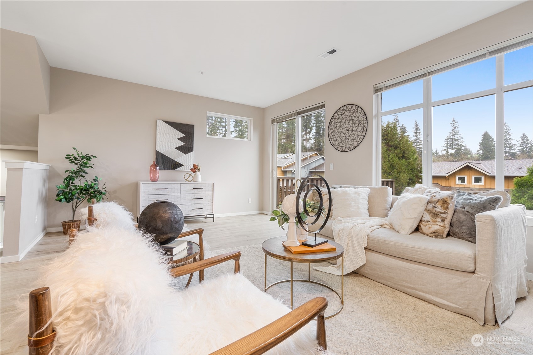 149 Cougar Ridge Road Northwest Issaquah, WA 98027 - Photo 8 of 37 a living room with furniture a rug and a fireplace