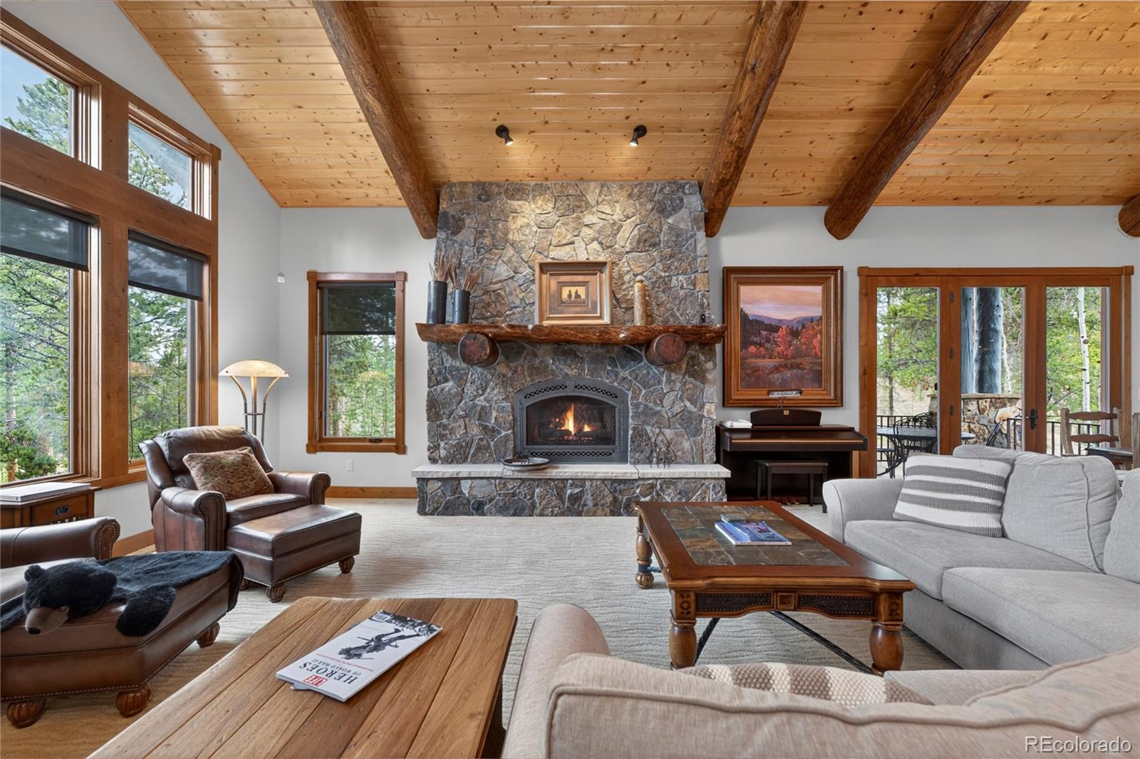 148 County Road Tabernash, CO 80478 - Photo 13 of 45 a living room with furniture fireplace and a large window