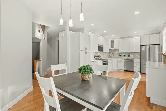 a view of kitchen and dining area with furniture