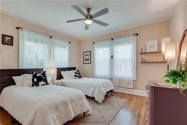 3353 Myrtle Street Hapeville, GA 30354 - Photo 17 of 22 a spacious bedroom with two beds and a potted plant