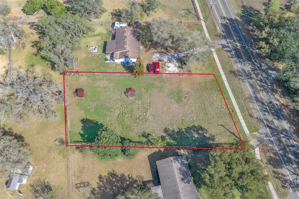 an aerial view of residential house with outdoor space